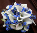 white miniature calla lilies and blue delphinium bouquet