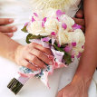 white rose and purple orchid bouquet